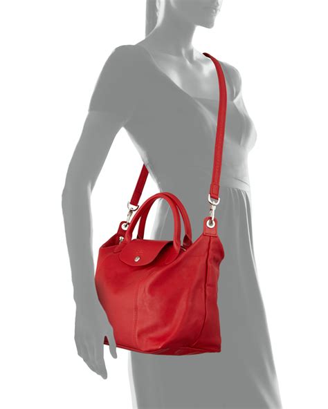 longchamp tote with long strap.